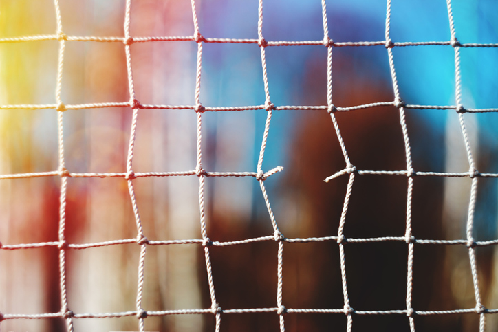 torn net on the football goal